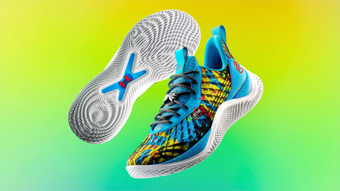 View of blue, yellow, and white Curry shoes.